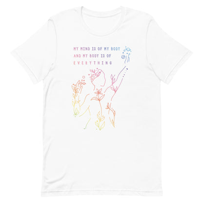 A white crewneck t-shirt, featuring an abstract illustration of a figure whose body is spreading out into plants and planets and stars. Text above the figure reads "My mind is of my body and my body is of everything."