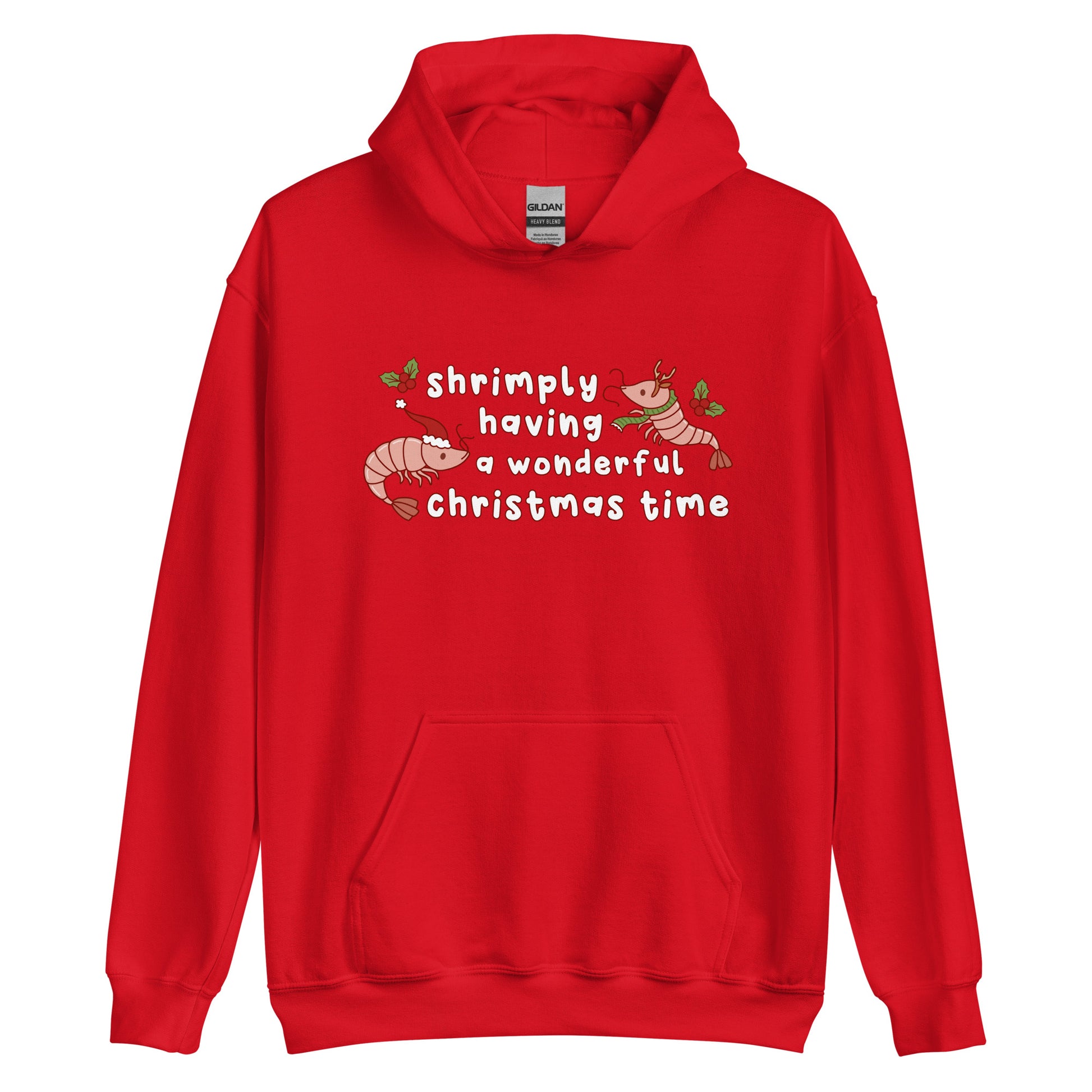 A red hooded sweatshirt featuring an illustration of two festive shrimp - one with a Santa hat, and one with reindeer antlers. Text between the shrimp reads "shrimply having a wonderful Christmas time".