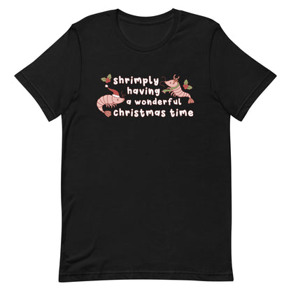 A black crewneck t-shirt featuring an illustration of two festive shrimp - one with a Santa hat, and one with reindeer antlers. Text between the shrimp reads "shrimply having a wonderful Christmas time".
