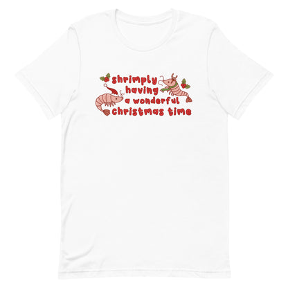 A white crewneck t-shirt featuring an illustration of two festive shrimp - one with a Santa hat, and one with reindeer antlers. Text between the shrimp reads "shrimply having a wonderful Christmas time".