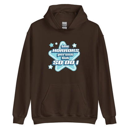 A dark brown hooded sweatshirt featuring blue and white stars over a halftone pattern with chunky text that reads "the horrors persist but so do i".