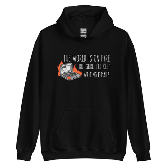 A black hooded sweatshirt featuring a squiggly illustration of a laptop that is on fire. Text alongside the laptop reads "the world is on fire but sure, I'll keep writing e-mails."