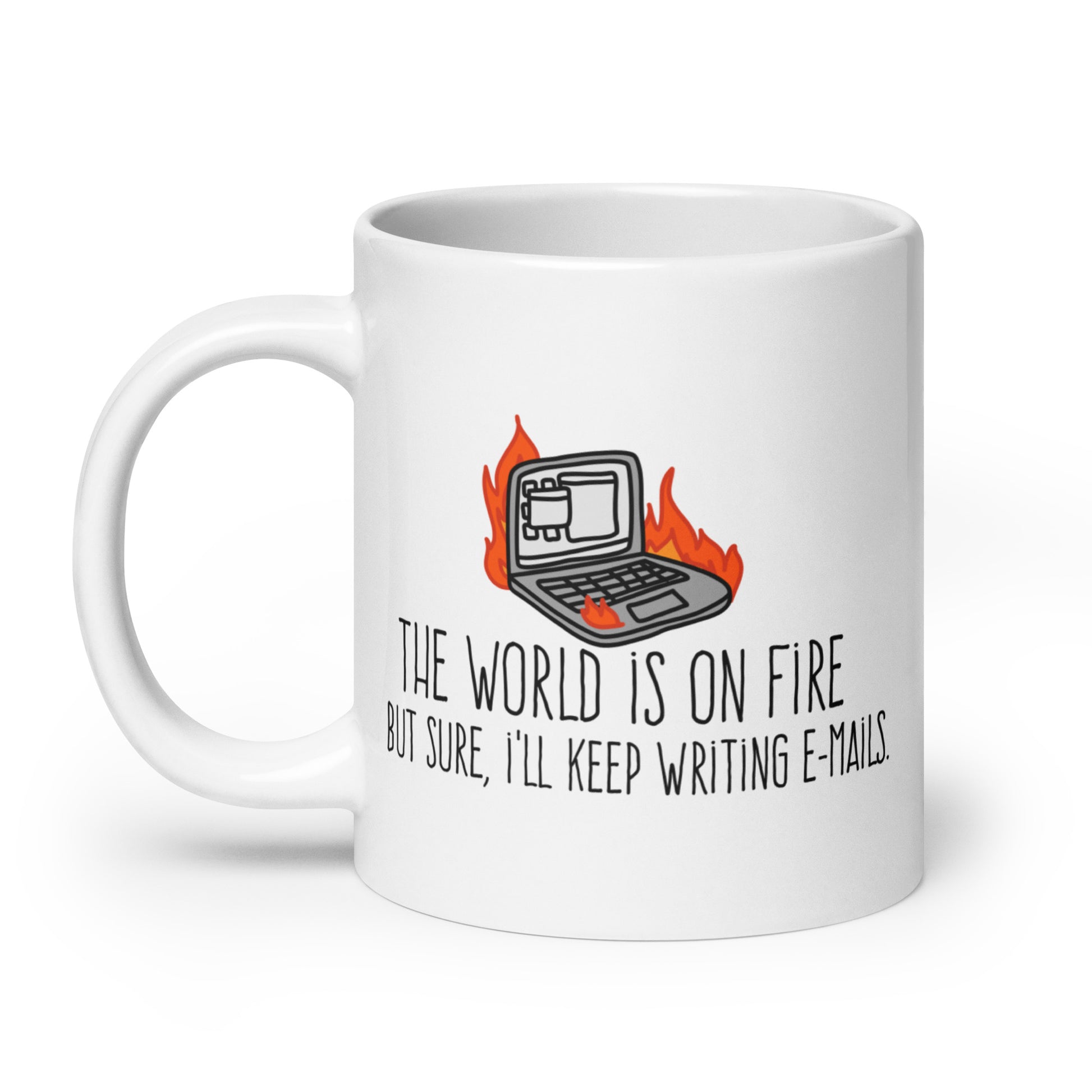 A white ceramic mug featuring a wobbly illustration of a laptop on fire. Text underneath the laptop reads "The world is on fire but sure, I'll keep writing e-mails"