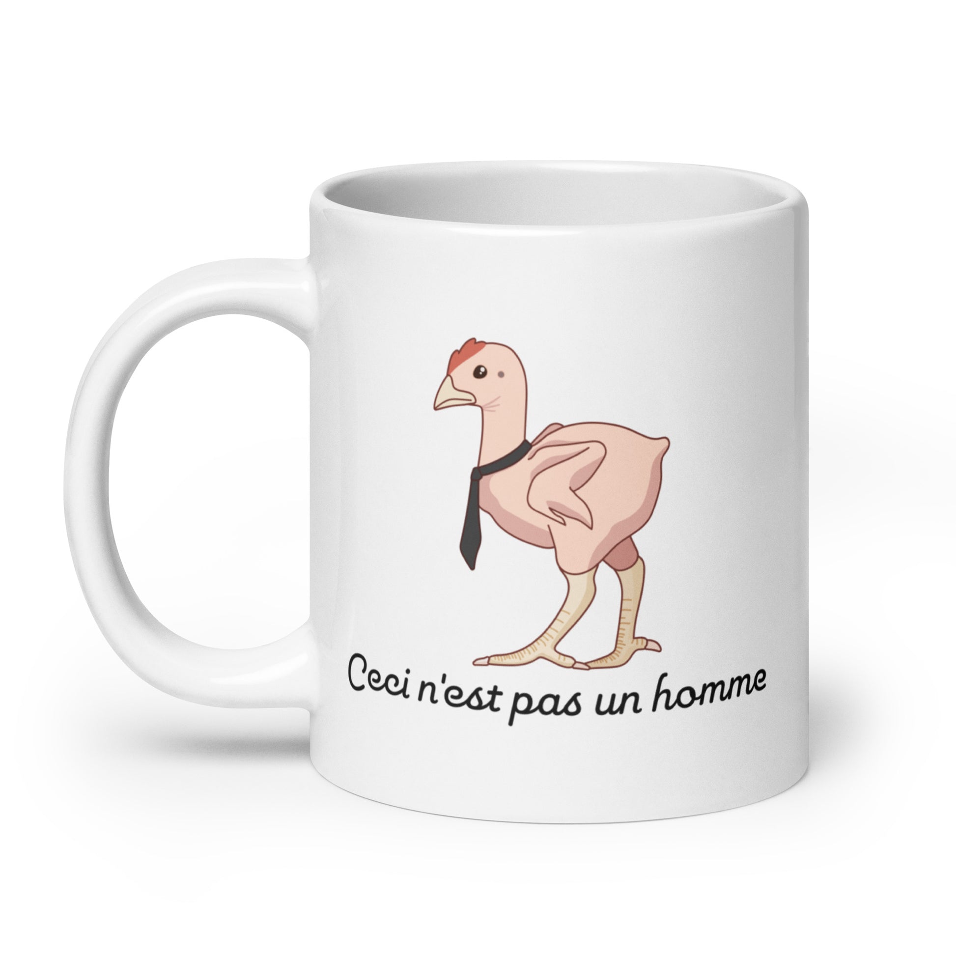 A 20 ounce ceramic mug featuring an illustration of a featherless chicken wearing a tie. Text underneath the chicken reads "Ceci n'est pas un homme" in a cursive font.