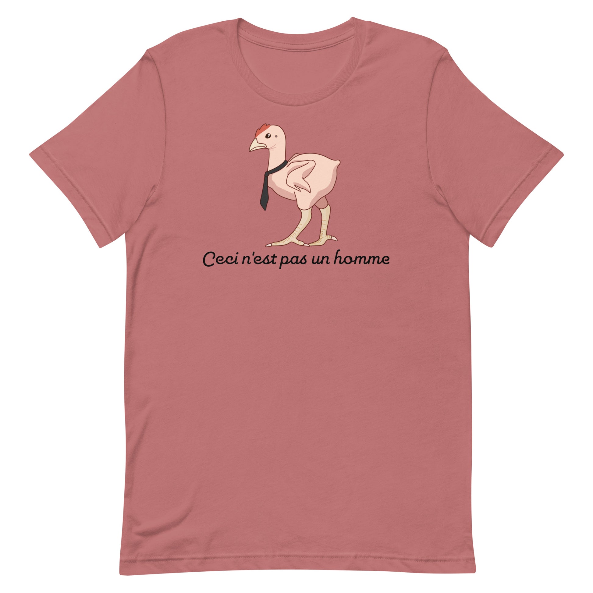 A dusky pink crewneck t-shirt featuring an illustration of a featherless chicken wearing a tie. Text underneath the chicken reads "Ceci n'est pas un homme" in a cursive font.