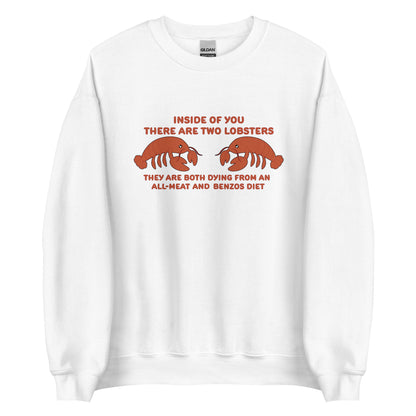 A white crewneck sweatshirt featuring an illustration of two lobsters. Text around the lobsters reads "Inside of you there are two lobsters. They are both dying from an all-meat and benzos diet."