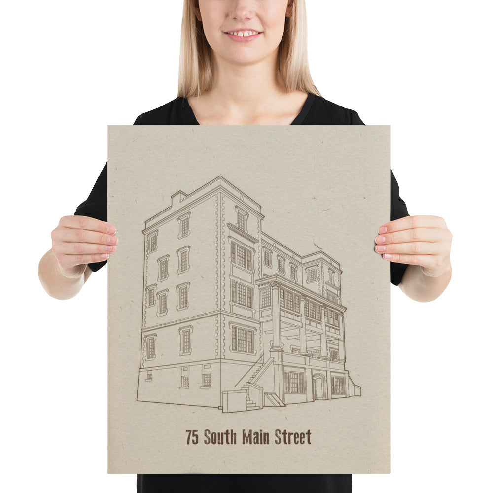 A woman holding an 16 inch by 20 inch print. The print is a sepia tone illustration of a building. The building is labeled "75 South Main Street"