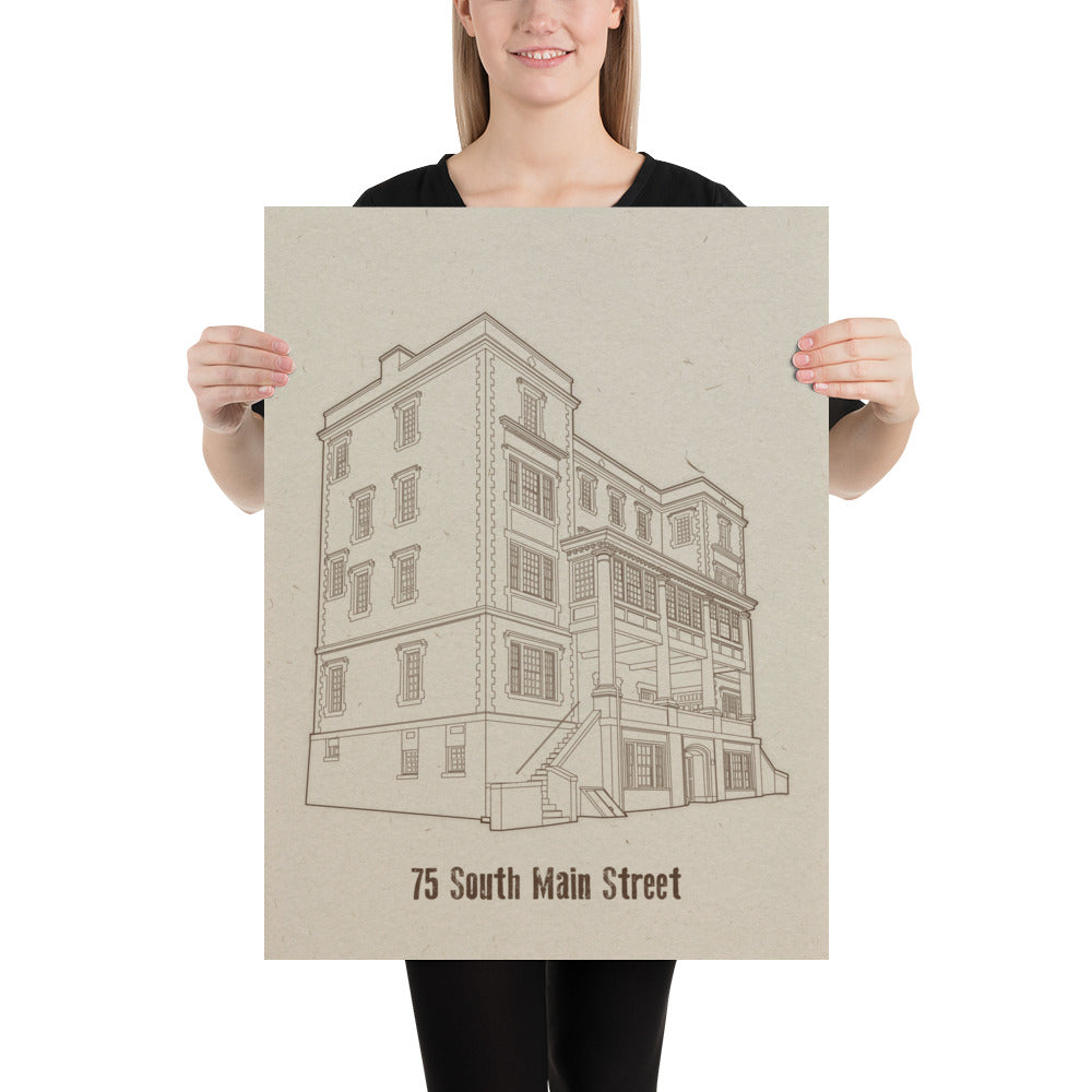 A woman holding an 18 inch by 24 inch print. The print is a sepia tone illustration of a building. The building is labeled "75 South Main Street"