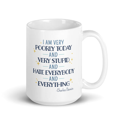 A white ceramic 15 ounce mug with a quote from Charles Darwin in blue text. The quote reads "I am very poorly today and very stupid and hate everybody and everything".