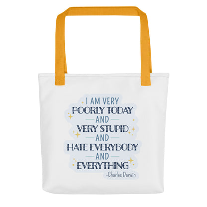 A white canvas tote bag with yellow handles and a quote from Charles Darwin in blue text. The quote reads "I am very poorly today and very stupid and hate everybody and everything".