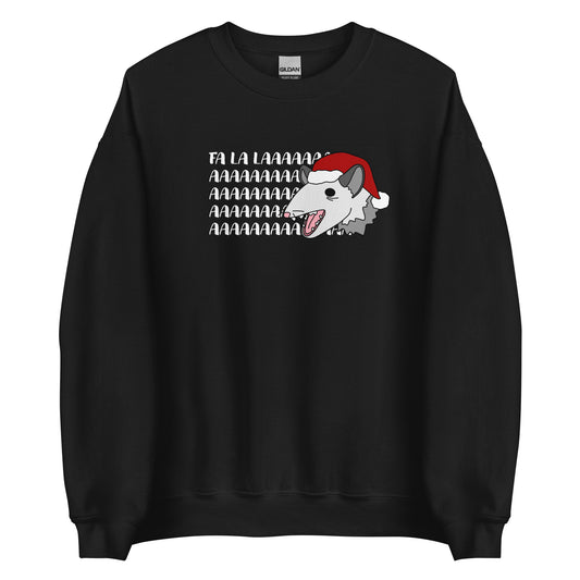 A black crewneck sweatshirt featuring an illustration of a possum wearing a Santa hat. The possum appears to be screaming, and text behind his head reads "FA LA LAAAAAA"