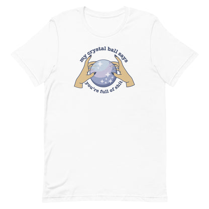 A white crewneck t-shirt with an image of two hands on a crystal ball and text that reads "My crystal ball says you're full of shit"