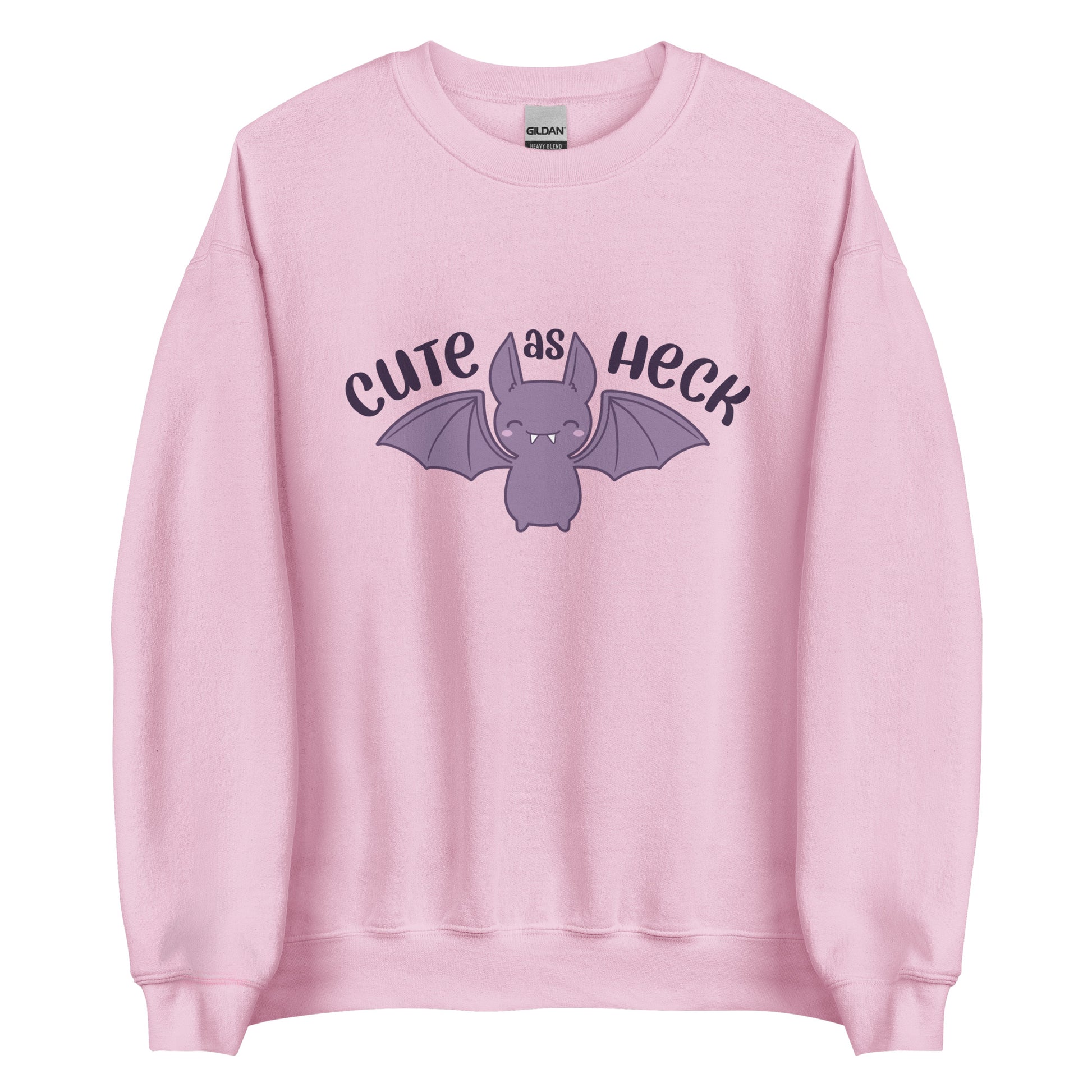 A pink crewneck sweatshirt featuring a smiling purple bat and text reading "Cute As Heck"