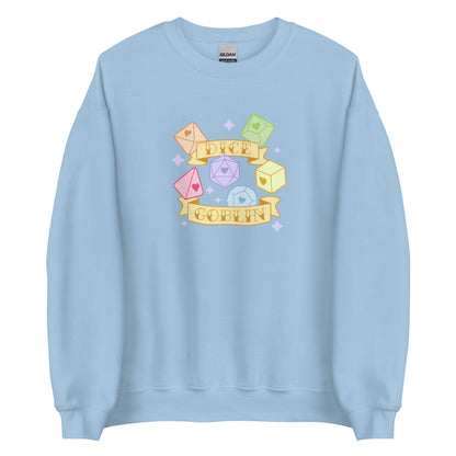 A light blue crewneck sweatshirt featuring an image of six polyhedral dice in pastel rainbow colors. Two banners surround the dice. Text on the banners reads "Dice Goblin"