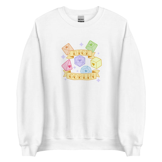 A white crewneck sweatshirt featuring an image of six polyhedral dice in pastel rainbow colors. Two banners surround the dice. Text on the banners reads "Dice Goblin"