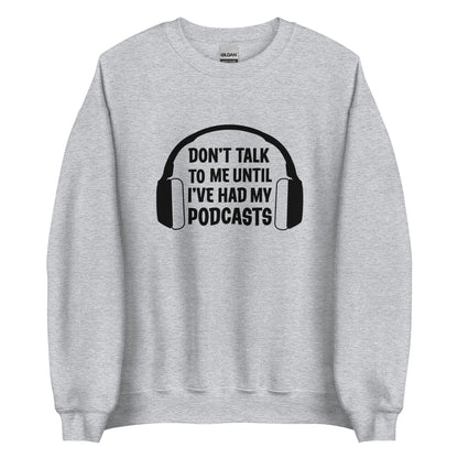 Light gray crewneck sweatshirt with an image of headphones and text reading "Don't talk to me until I've had my podcasts"