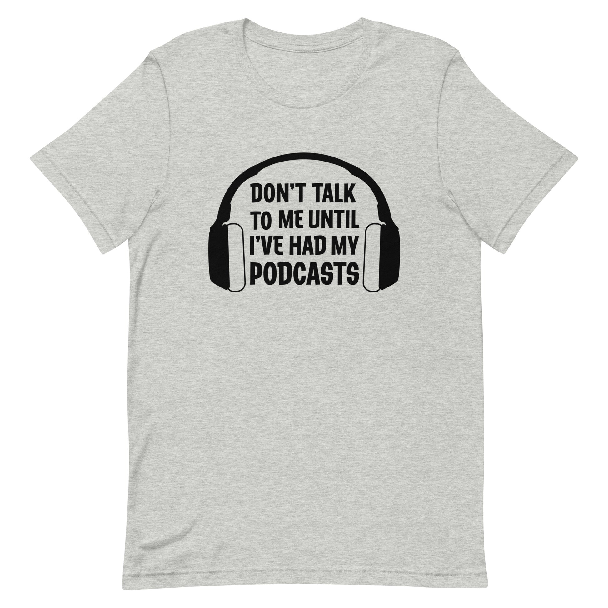 A light gray crewneck t-shirt featuring an image of headphones surrounding text reading "Don't talk to me until I've had my podcasts"