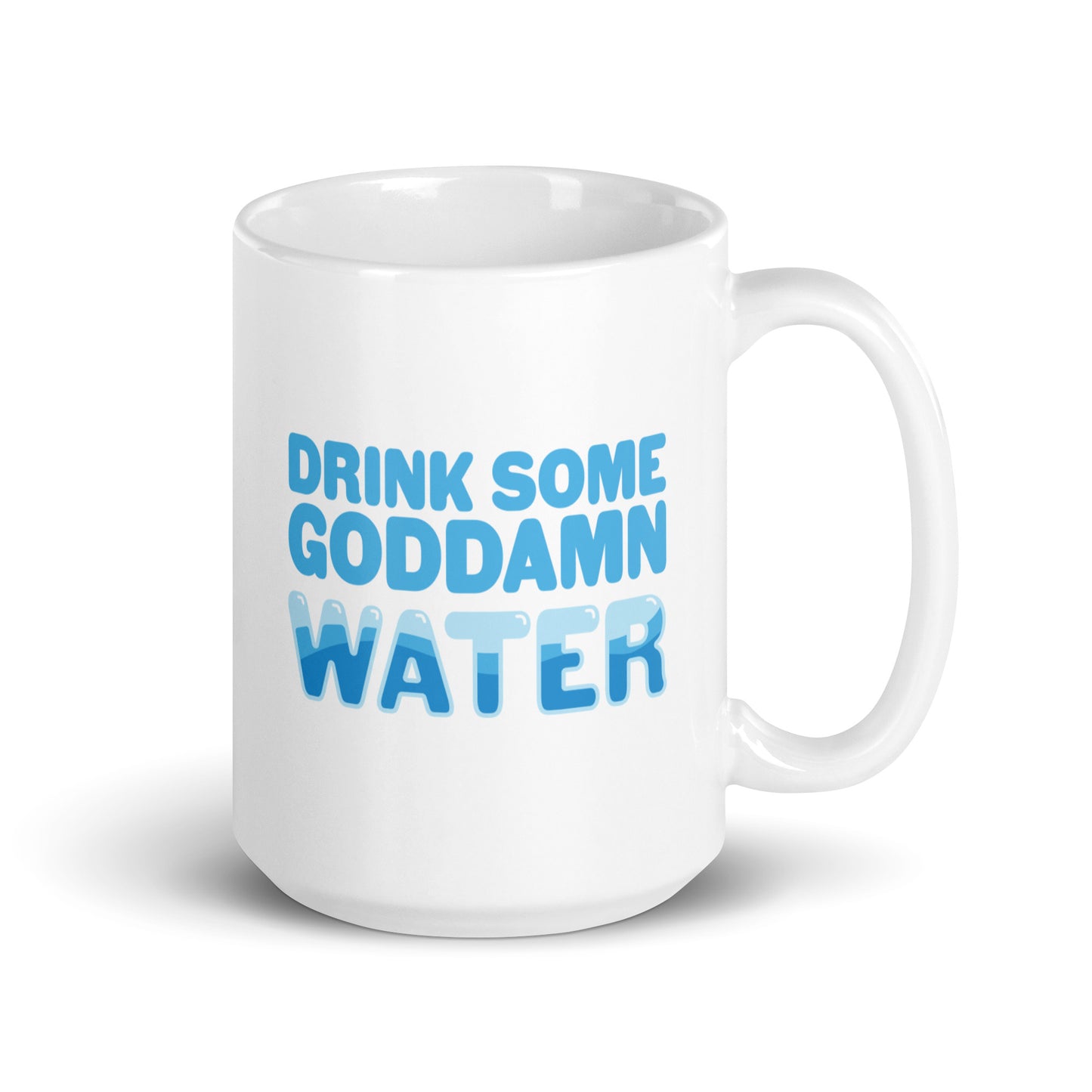 A white 15 ounce ceramic mug with blue bubble letters that read "Drink some goddamn water"