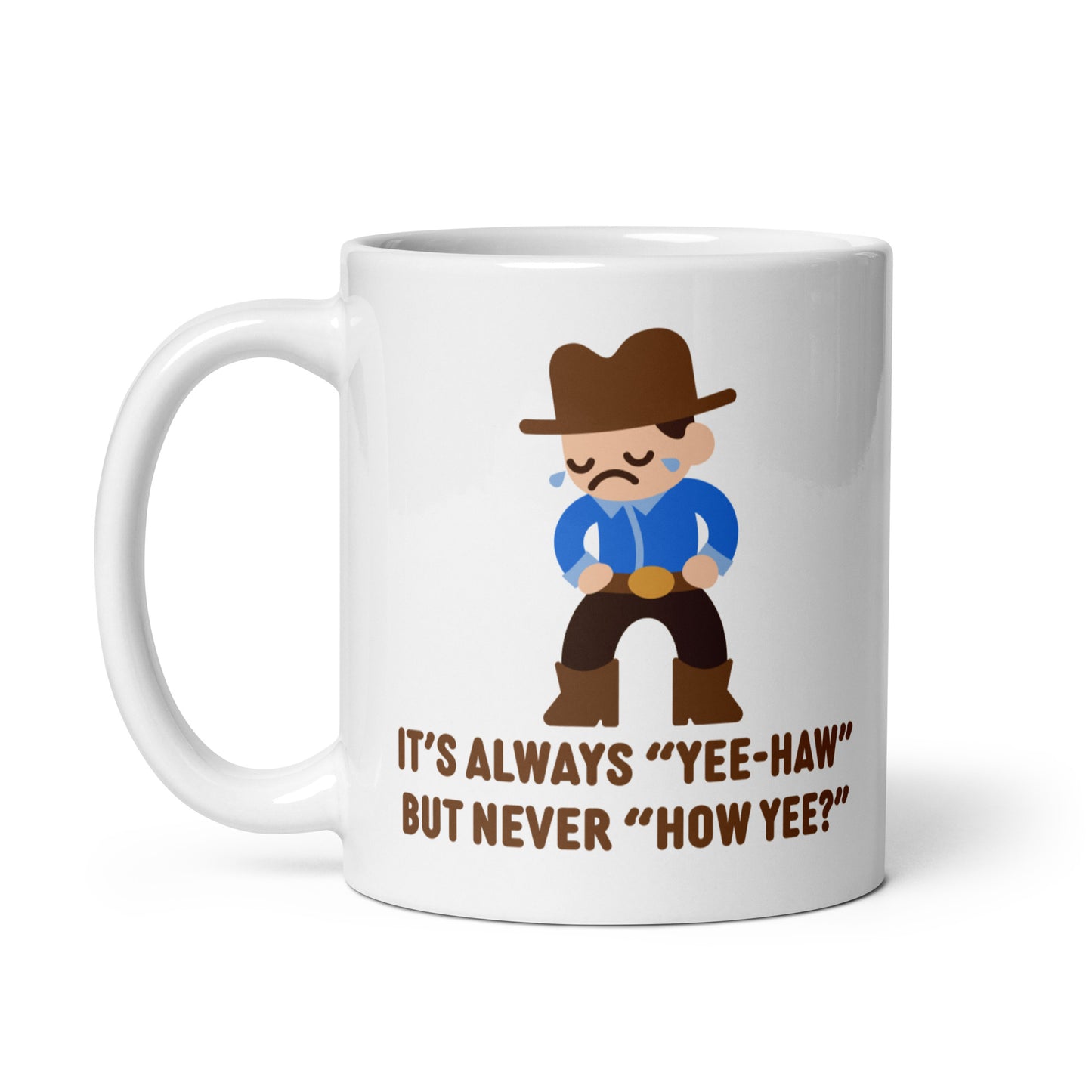 A white 11 ounce ceramic coffee mug featuring an illustration of a crying cowboy wearing a blue shirt. Text below the cowboy reads "It's always "yee-haw" but never "How yee?""