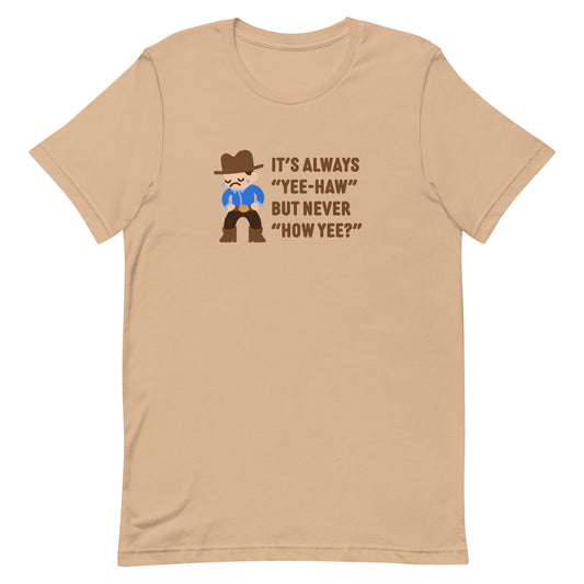 A tan crewneck t-shirt featuring an illustration of a crying cowboy wearing a blue shirt. Text alongside the cowboy reads "It's always "yee-haw" but never "How yee?""