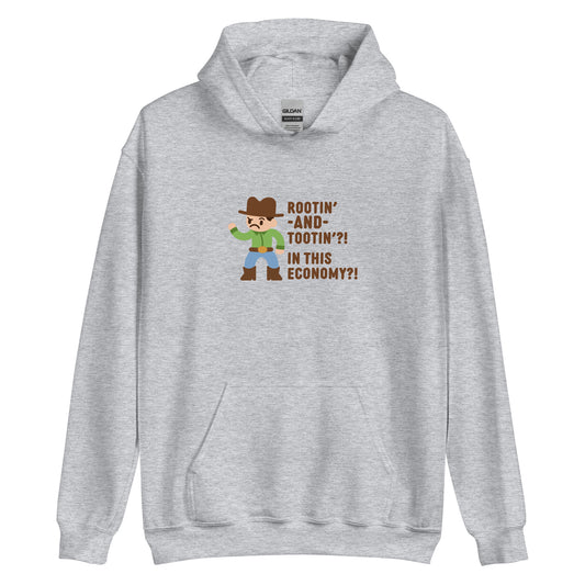 A grey hooded sweatshirt featuring an illustration of a confused-looking cowboy wearing a green shirt. Text to the right of the cowboy reads "Rootin' AND tootin'?! In this economy?!"