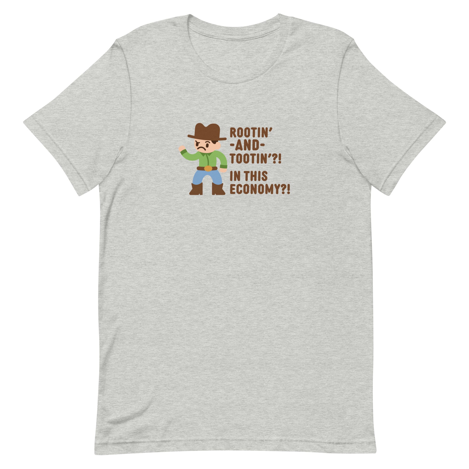 A grey crewneck t-shirt featuring an illustration of a confused-looking cowboy wearing a green shirt. Text to the right of the cowboy reads "Rootin' AND tootin'?! In this economy?!"