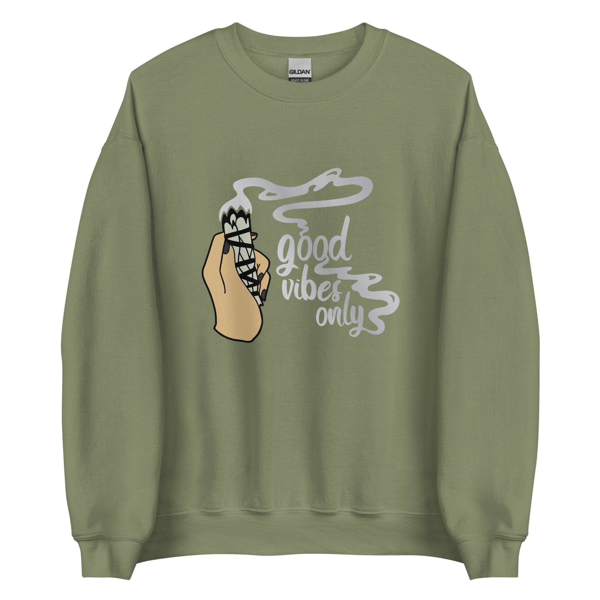 An olive green crewneck sweatshirt featuring an illustration of a hand holding a sage smudge stick. Smoke flows from the tip of the sage and forms text reading "Good vibes only"