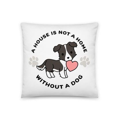 A white, 18" x 18" pillow featuing a cute, stylized illustration of a Border Collie holding a heart in its mouth. Text in a circle around the dog reads "A house is not a home without a dog"