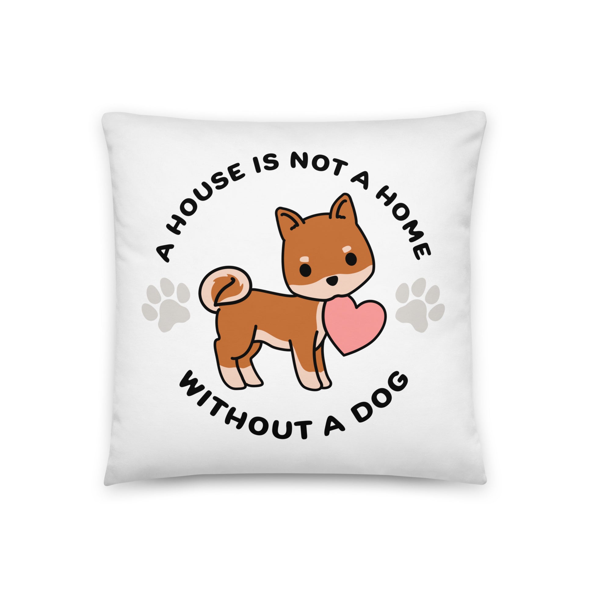 A white, 18" x 18" pillow featuing a cute, stylized illustration of a Shiba Inu holding a heart in its mouth. Text in a circle around the dog reads "A house is not a home without a dog"