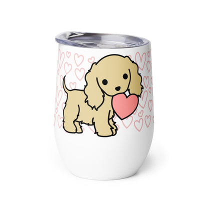 A white metal wine tumbler with a plastic lid. A pattern of hearts wraps around the top half of the tumbler. Centered on the tumbler is a cute, stylized illustration of a Cocker Spaniel.