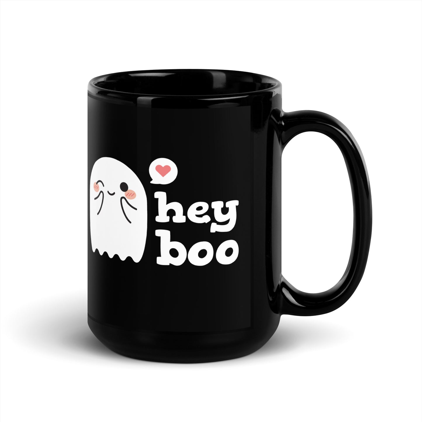 A black 15 ounce coffee mug featuring an illustration of a blushing and smiling ghost next to text that reads "hey boo"