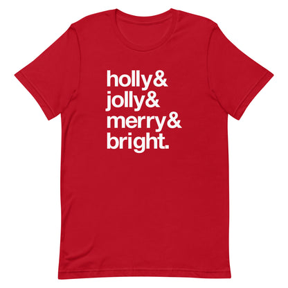 A red crewneck t-shirt with four lines of white text that read "Holly & Jolly & Merry & Bright."