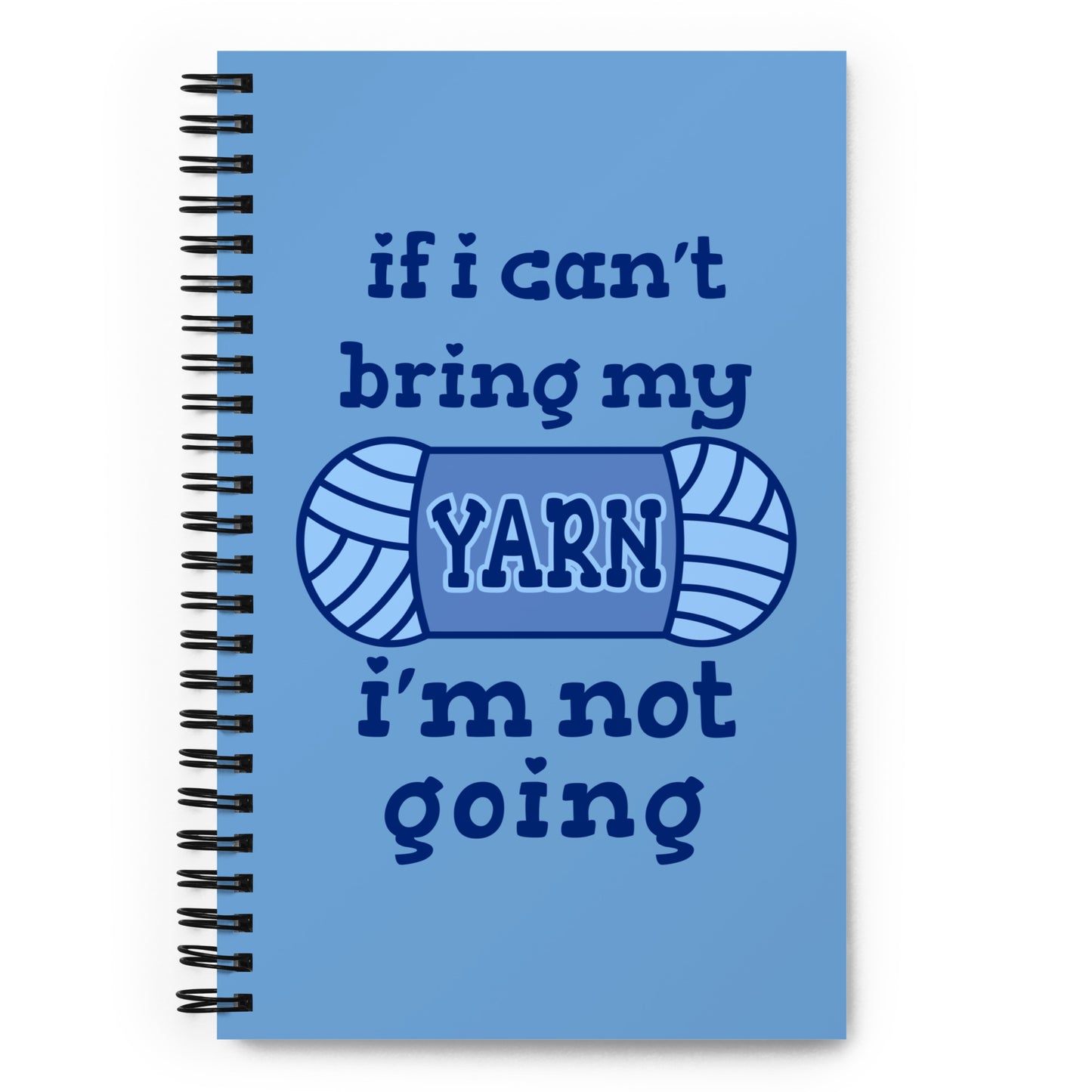 A blue wire-bound notebook with text reading "If I can't bring my yarn, I'm not going". The word "yarn" is centered on an illustration of a skein of yarn.