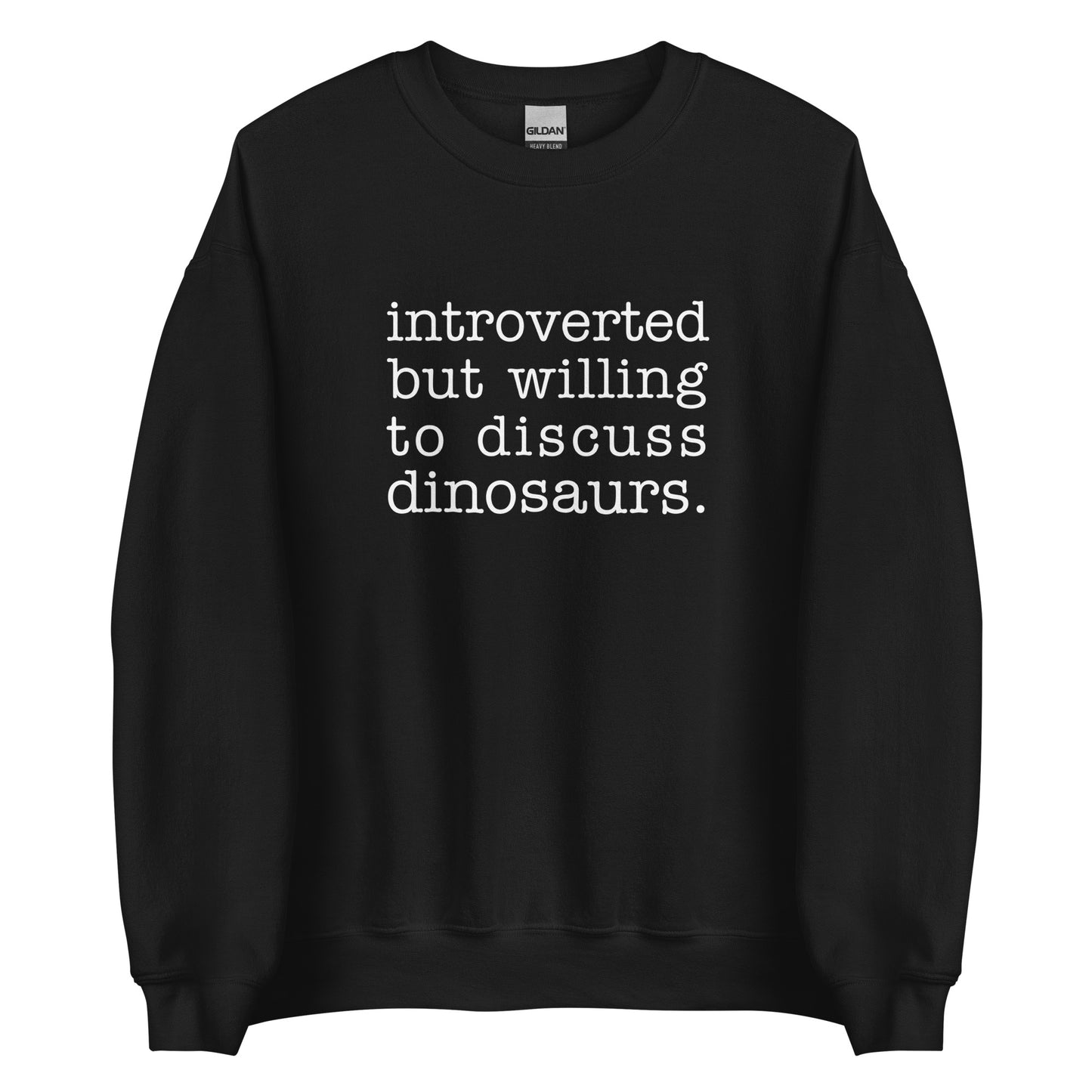 A black crewneck sweatshirt with white text reading "introverted but willing to discuss dinosaurs"