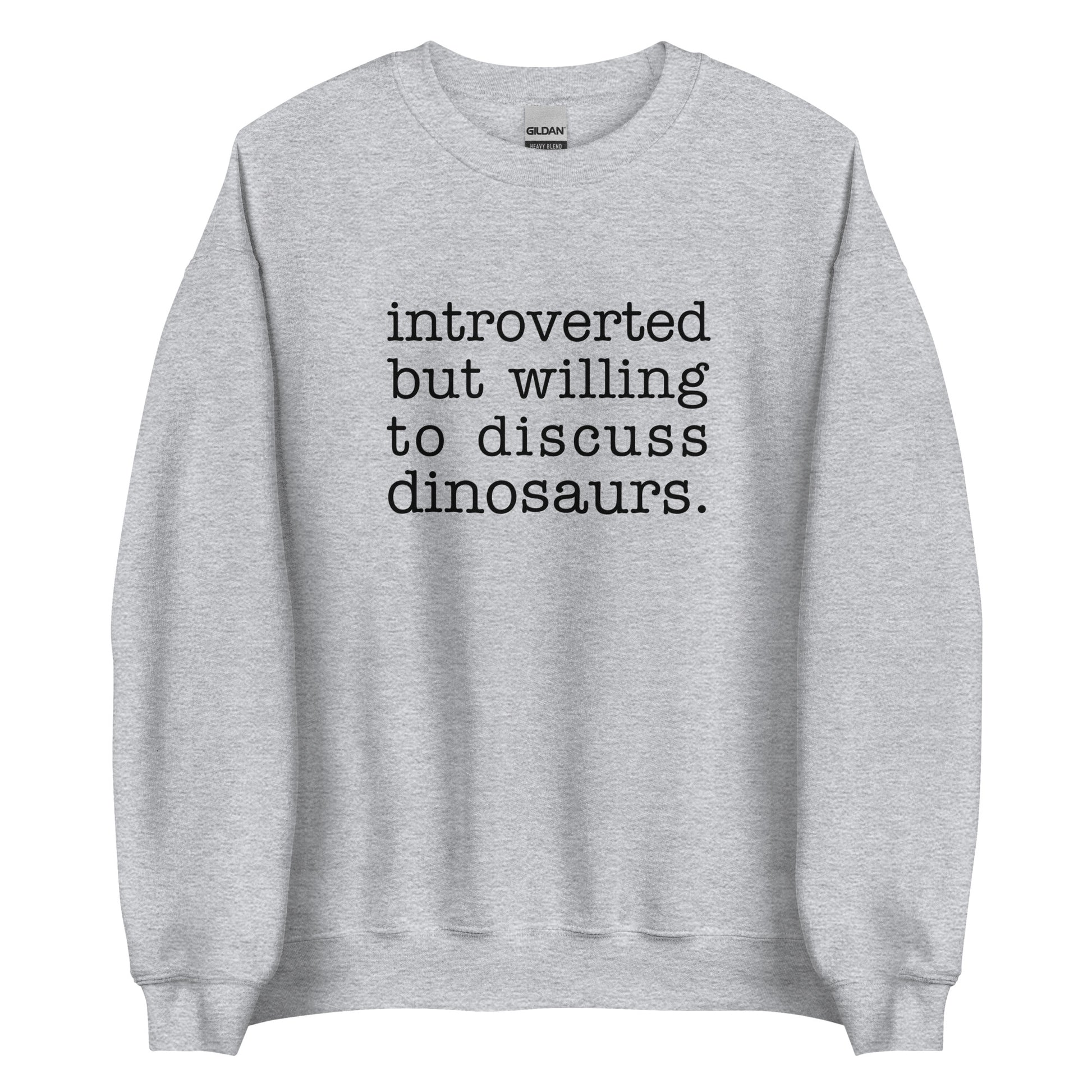 A heathered grey crewneck sweatshirt with black text reading "introverted but willing to discuss dinosaurs"