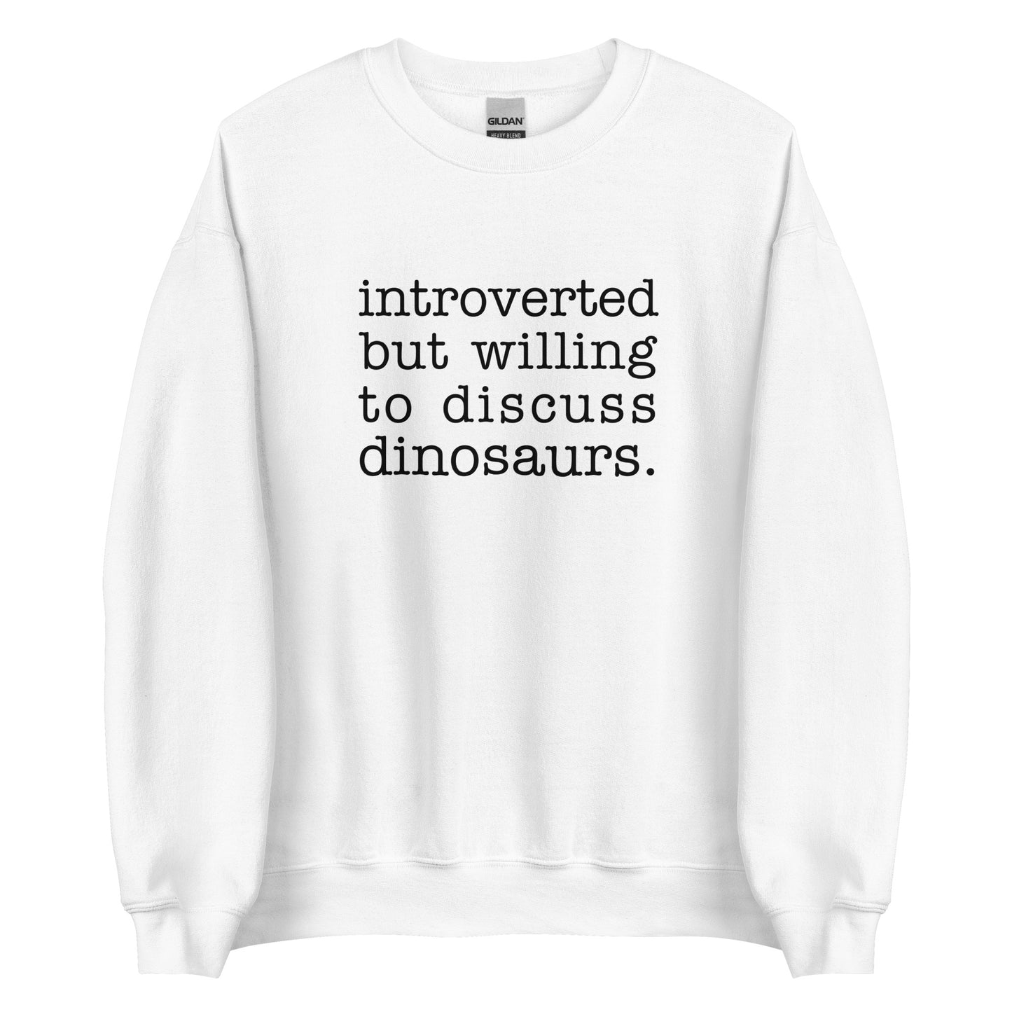 A white crewneck sweatshirt with black text reading "introverted but willing to discuss dinosaurs"