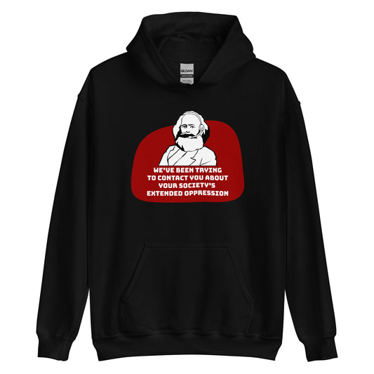 A black hooded sweatshirt featuring a black and white illustration of Karl Marx wearing a telemarketer headset. Text beneath Marx reads "We've been trying to contact you about your society's extended oppression." in a blocky font.