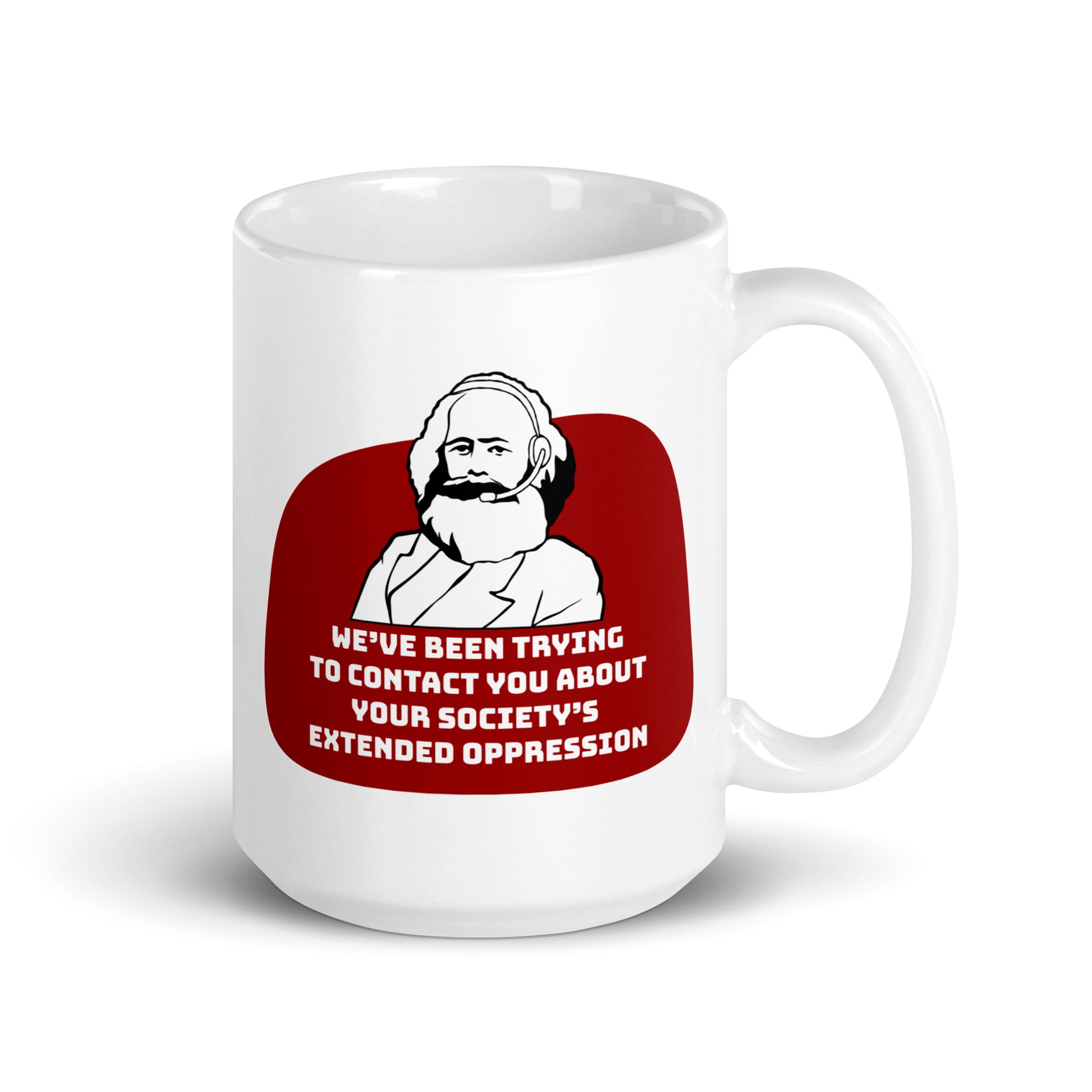 A 15 ounce, white ceramic mug featuring a black and white illustration of Karl Marx wearing a telemarketer headset. Text beneath Marx reads "We've been trying to contact you about your society's extended oppression." in a blocky font.