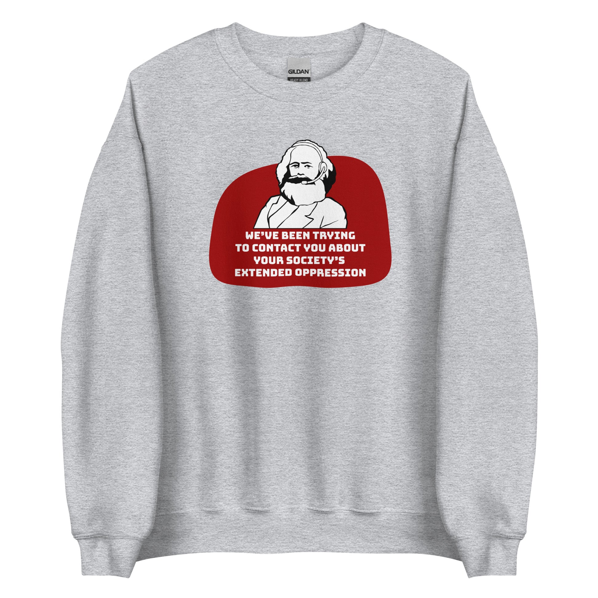 A grey crewneck sweatshirt featuring a black and white illustration of Karl Marx wearing a telemarketer headset. Text beneath Marx reads "We've been trying to contact you about your society's extended oppression." in a blocky font.