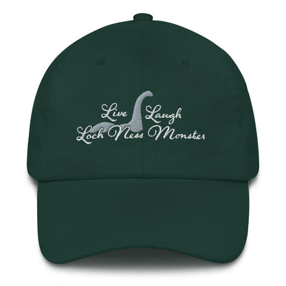 An image of the front side of a forest green baseball cap. White embroidered text decorates the front of the hat reading "Live Laugh Loch Ness Monster" with a silhouette of Nessie.