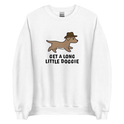 A white crewneck sweatshirt featuring an image of a dachshund wearing a cowboy hat. Text below the dog reads "Get a long little doggie"