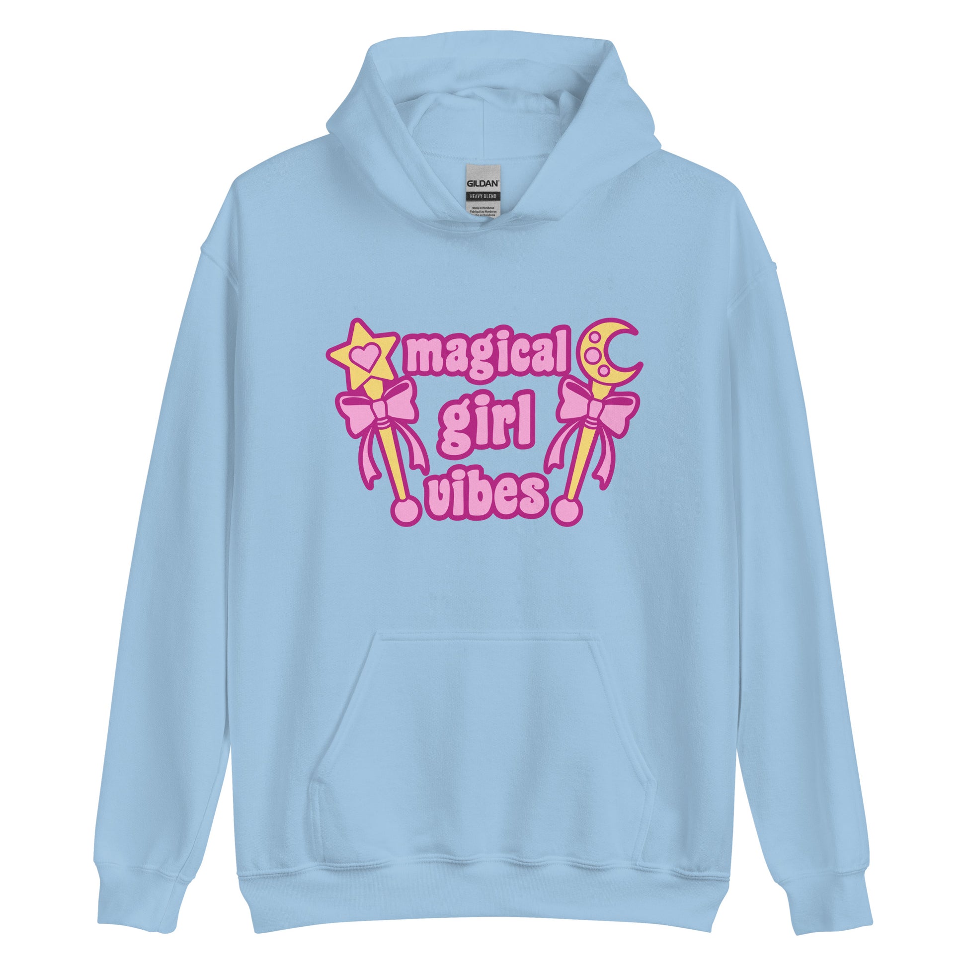 A light blue hooded sweatshirt featuring two gold wands with pink bows and pink text reading "Magical girl vibes"