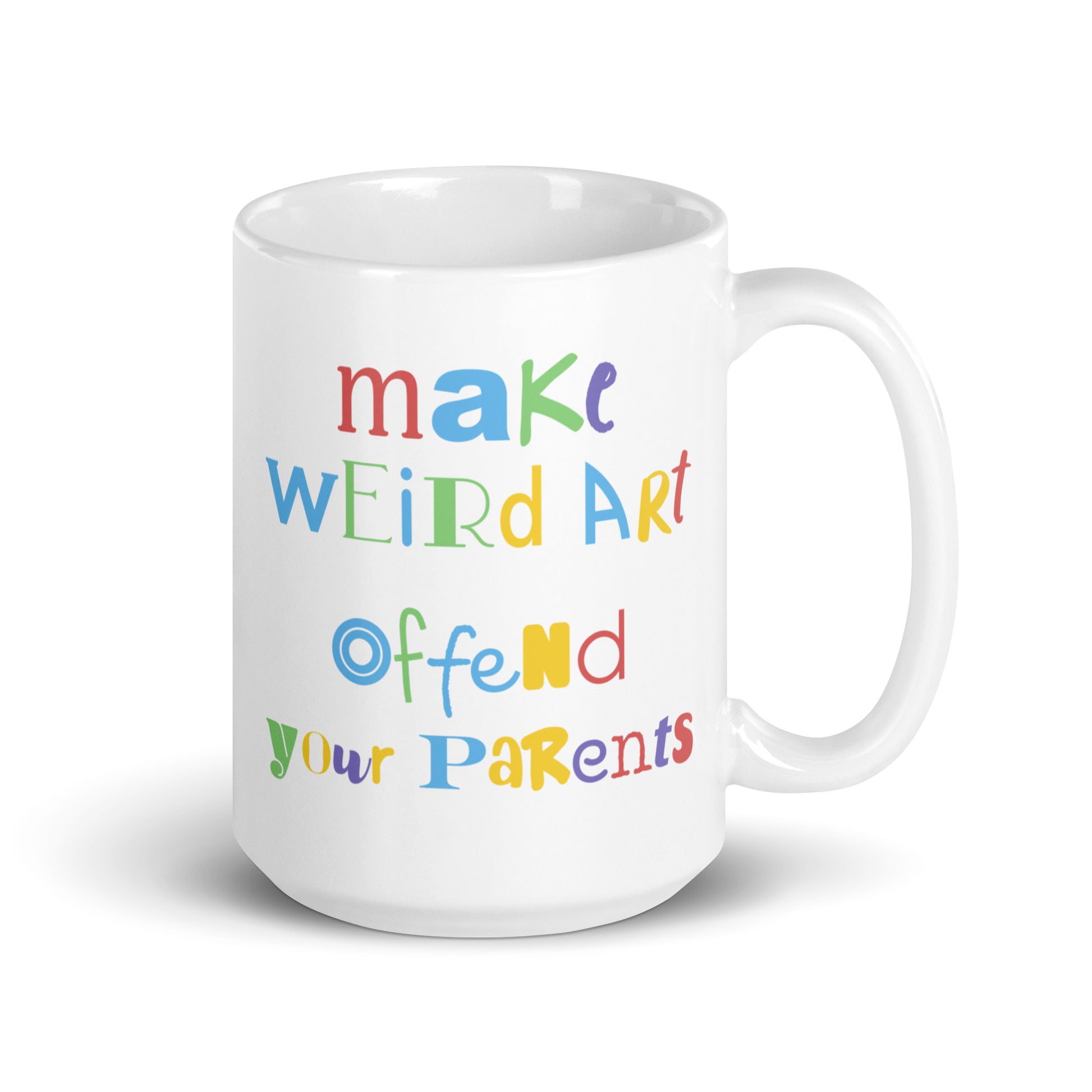A 15 ounce white ceramic mug featuring text that reads "make weird art, offend your parents" in varying fonts and colors