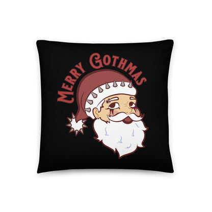A black 18" x 18" throw pillow featuring an image of Santa Claus. Santa is wearing goth-style makeup and his hat is decorated with spikes. Text above Santa's head reads "Merry Gothmas"