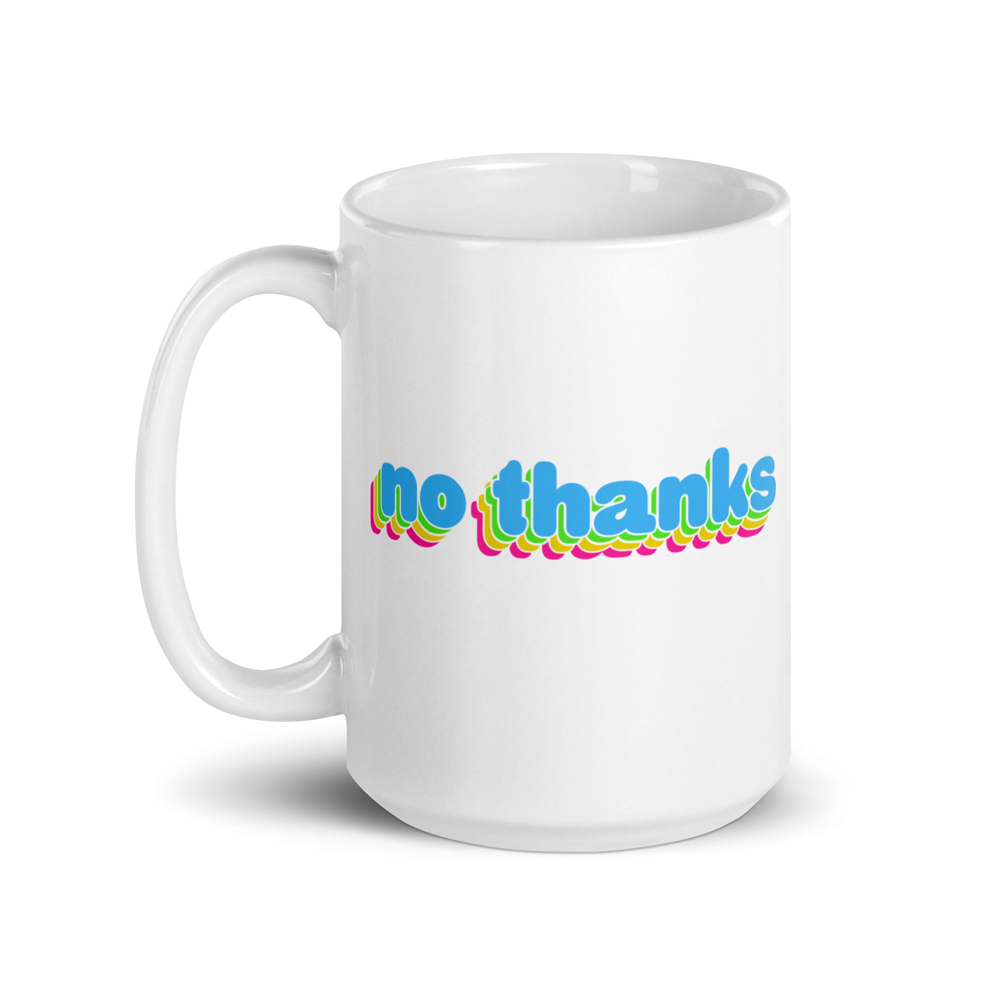 A white 15 oz ceramic mug with the handle to the left featuring colorful bubble text reading "no thanks"