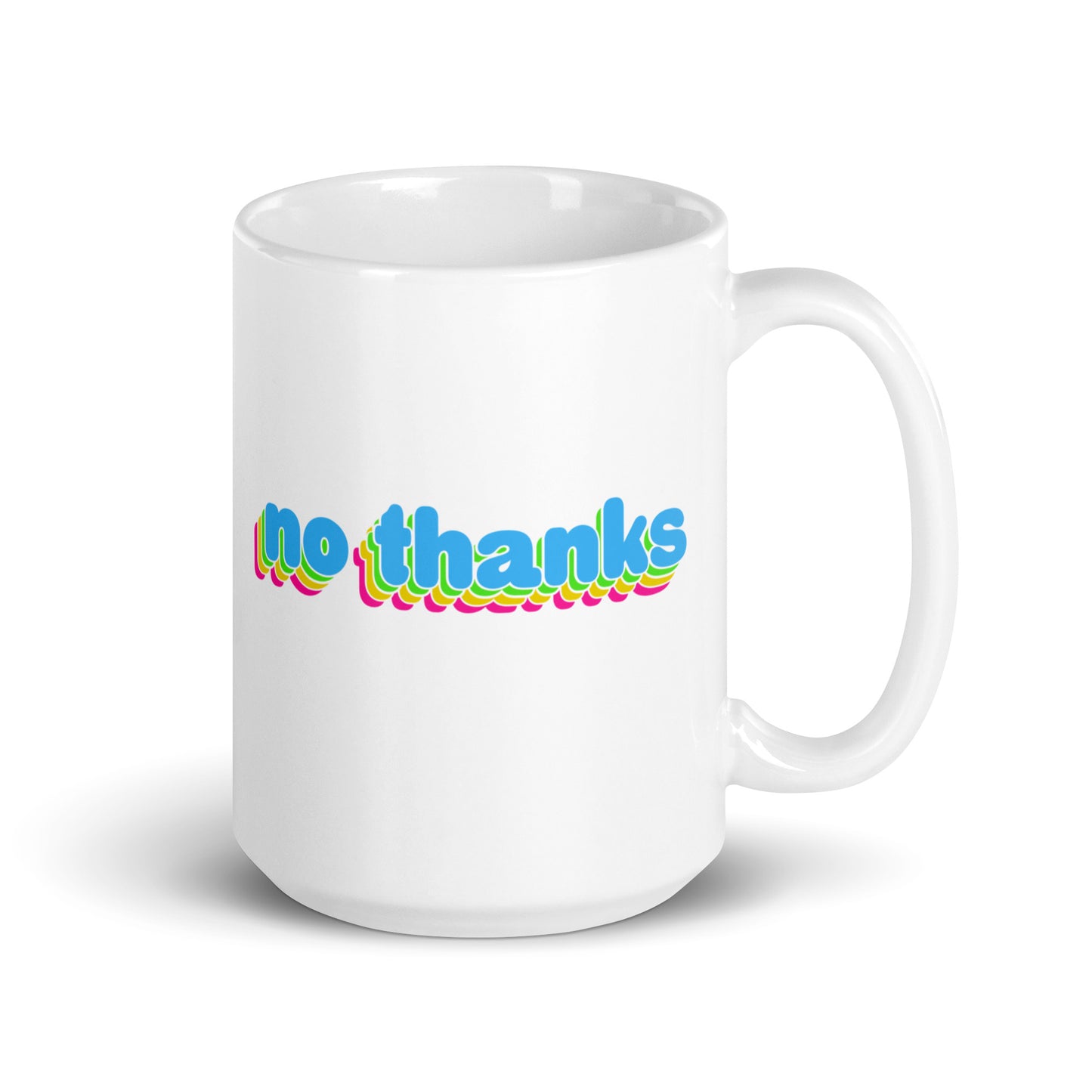 A white 15 oz ceramic mug with the handle to the right featuring colorful bubble text reading "no thanks"