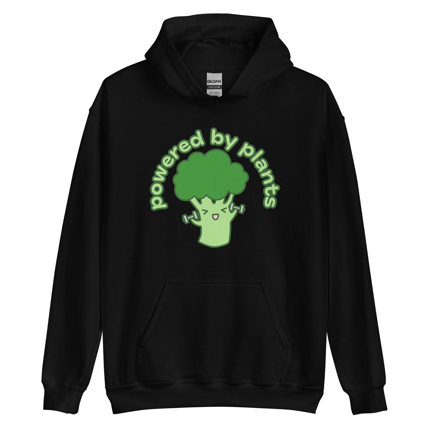 A black hooded sweatshirt featuring an illustration of a cartoon broccoli character. The broccoli is excitedly lifting weights, and text in an arc above the broccoli reads "powered by plants".