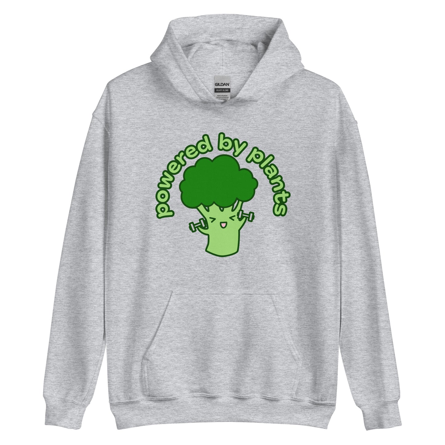 A grey hooded sweatshirt featuring an illustration of a cartoon broccoli character. The broccoli is excitedly lifting weights, and text in an arc above the broccoli reads "powered by plants".