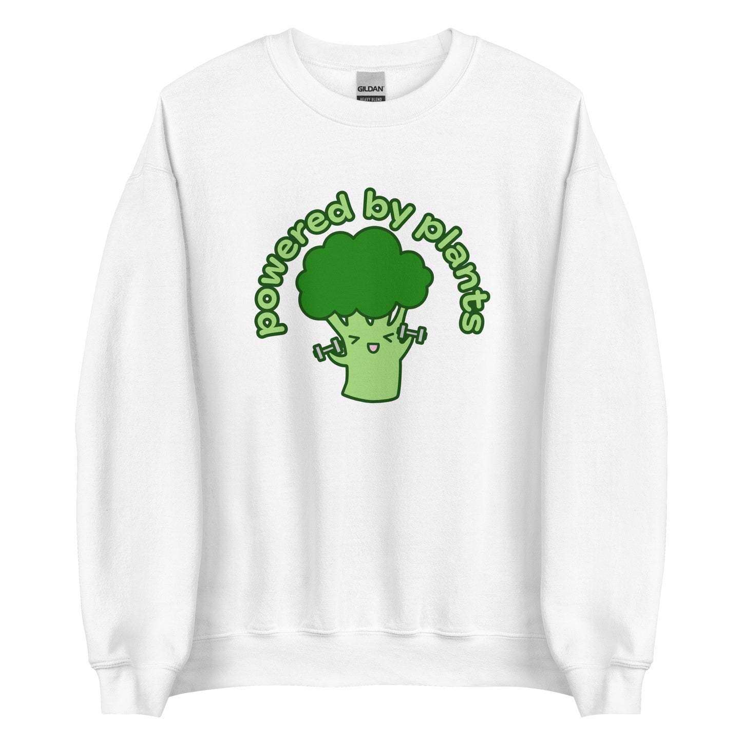 A white crewneck sweatshirt featuring an illustration of a cartoon broccoli character. The broccoli is excitedly lifting weights, and text in an arc above the broccoli reads "powered by plants".