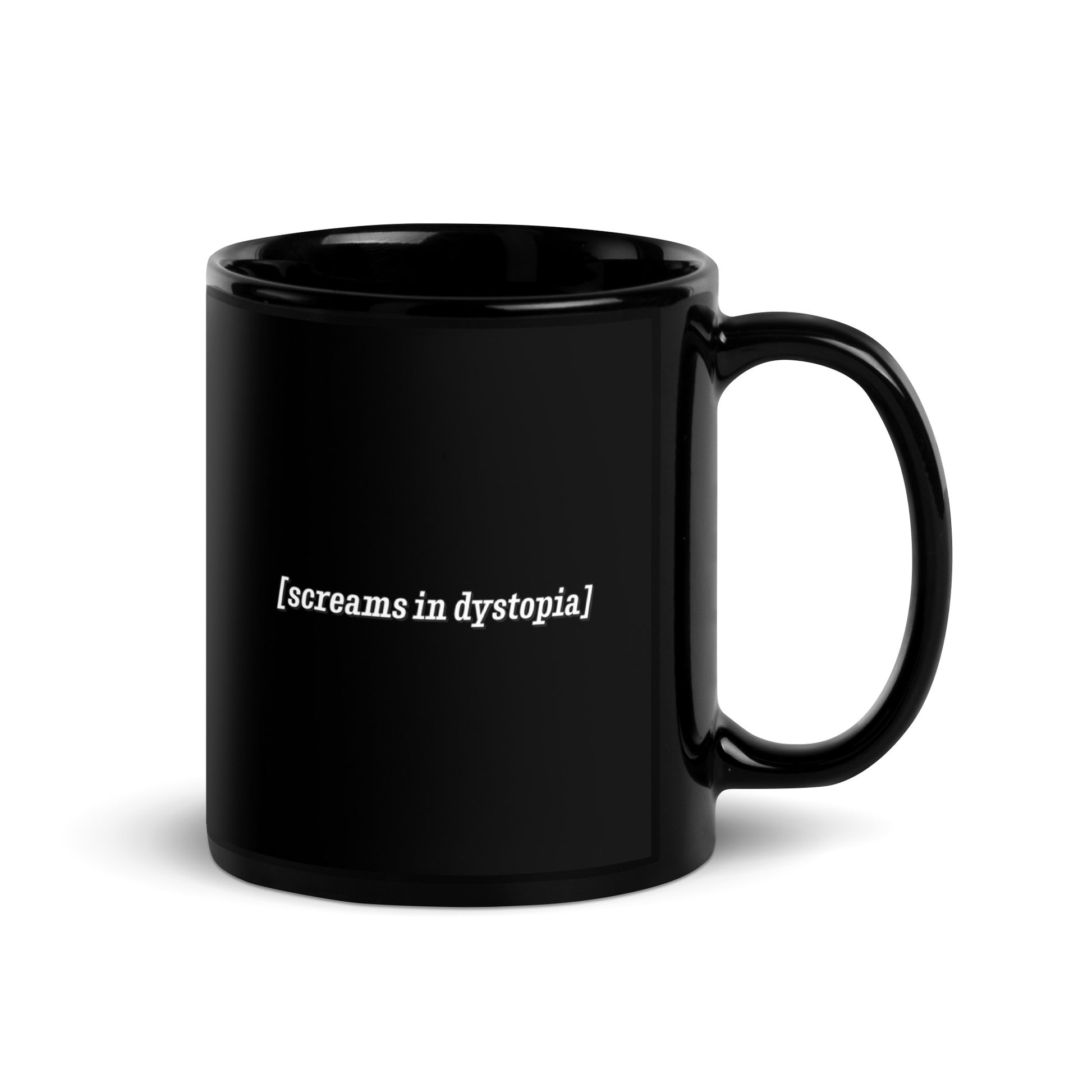 A black 11 ounce coffee mug with white text in the style of subtitles. The text reads "[screams in dystopia]".